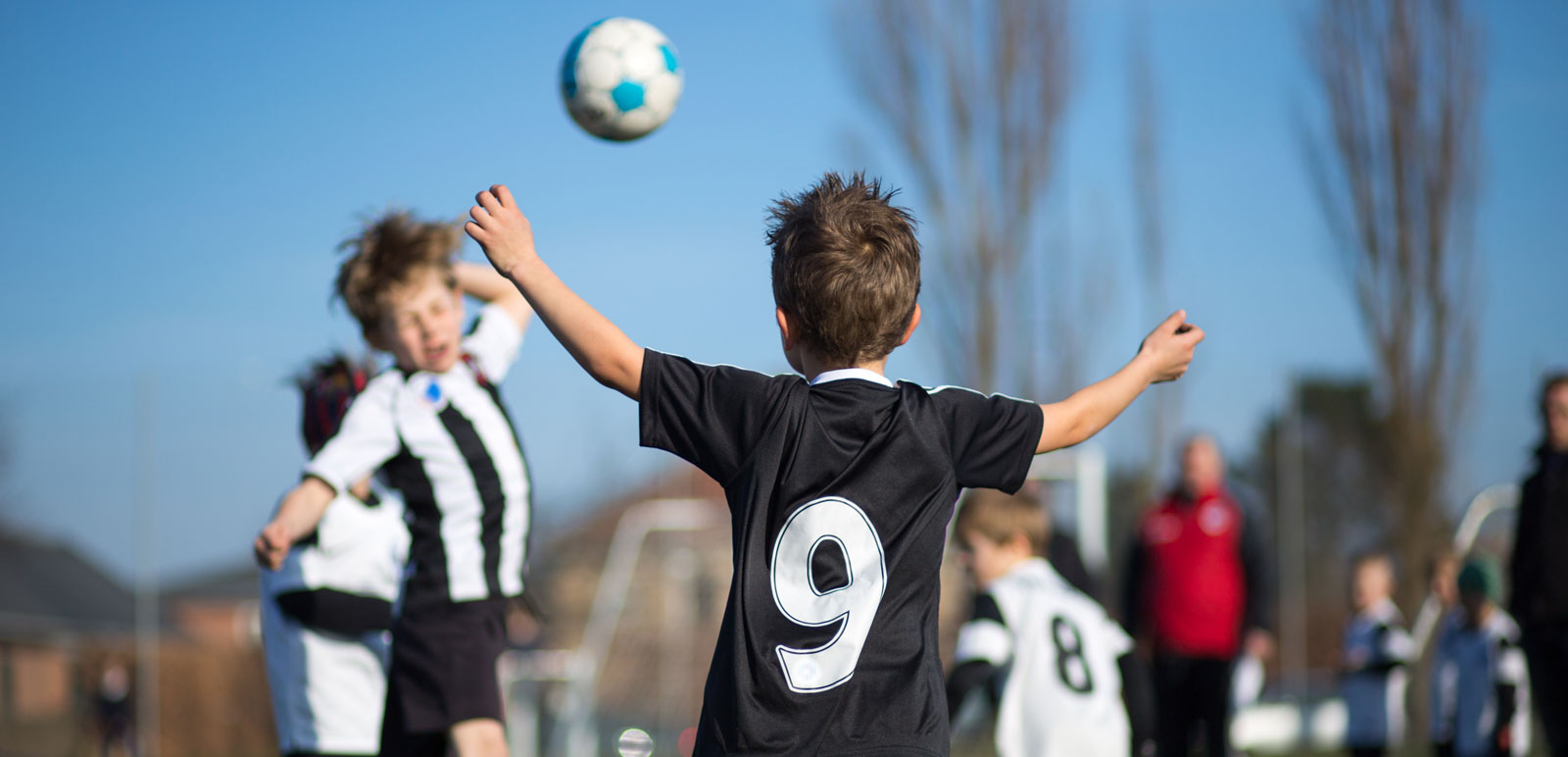 boys playing football