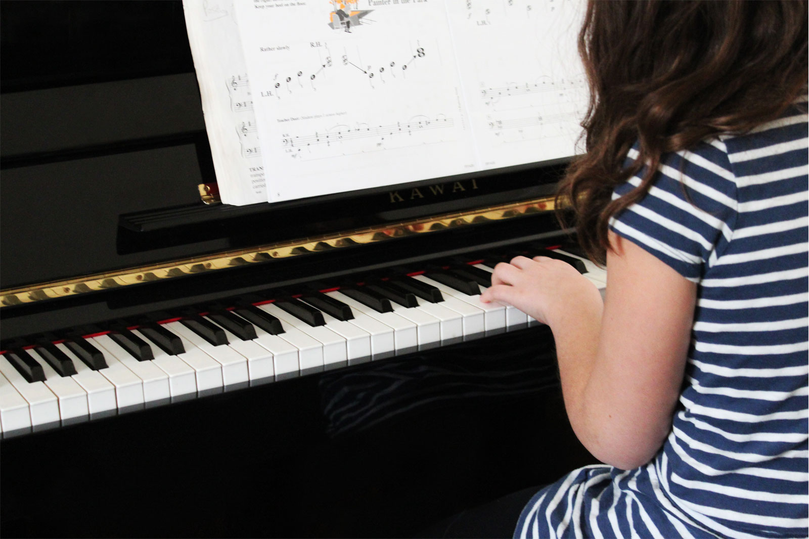 girl playing a piano
