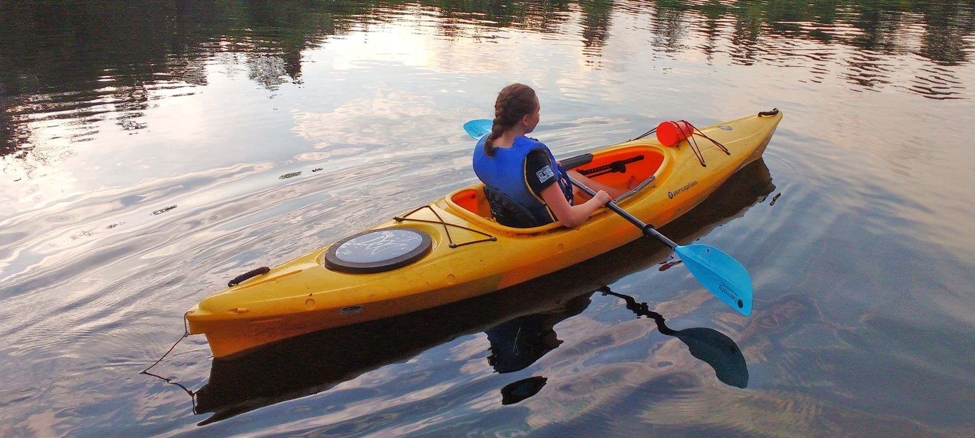 child kayaking