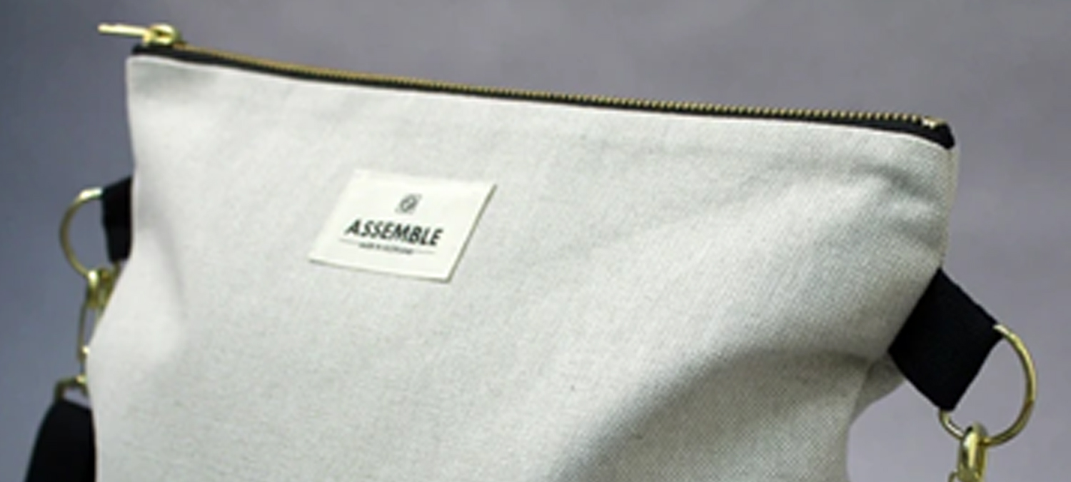 Assemble label on handbag