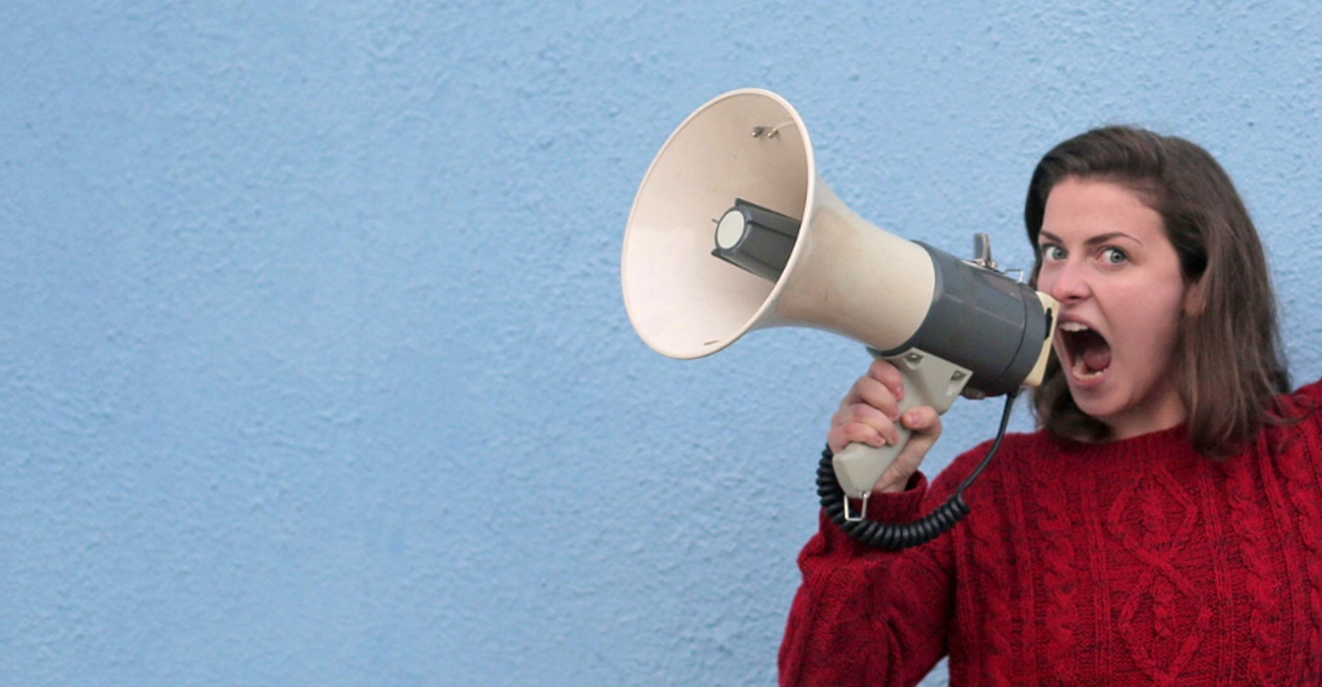 lady shouting into a megaphone