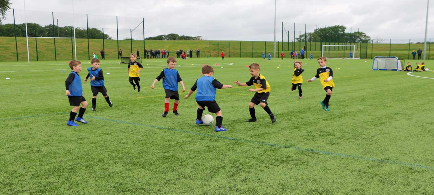 boys playing on the new pitch