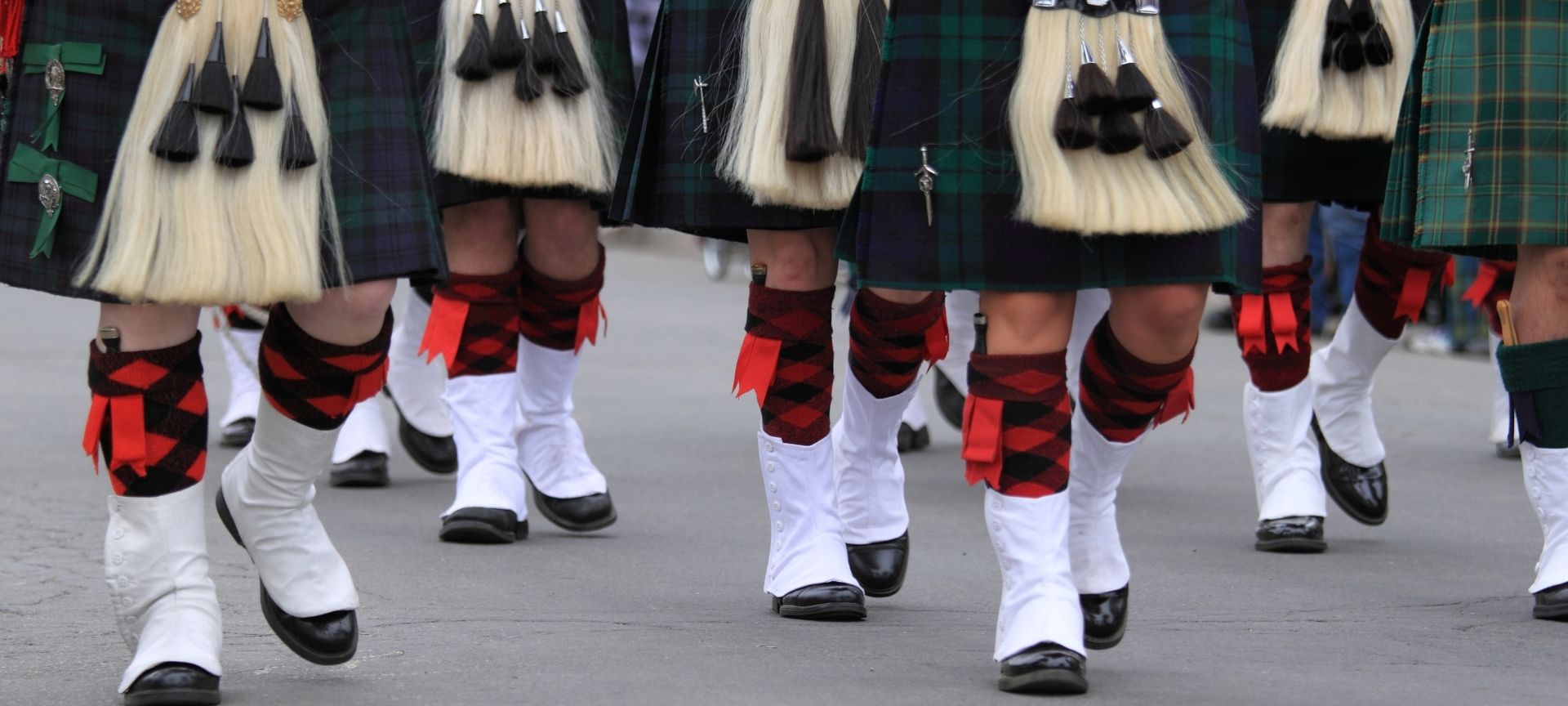 men marching in kilts