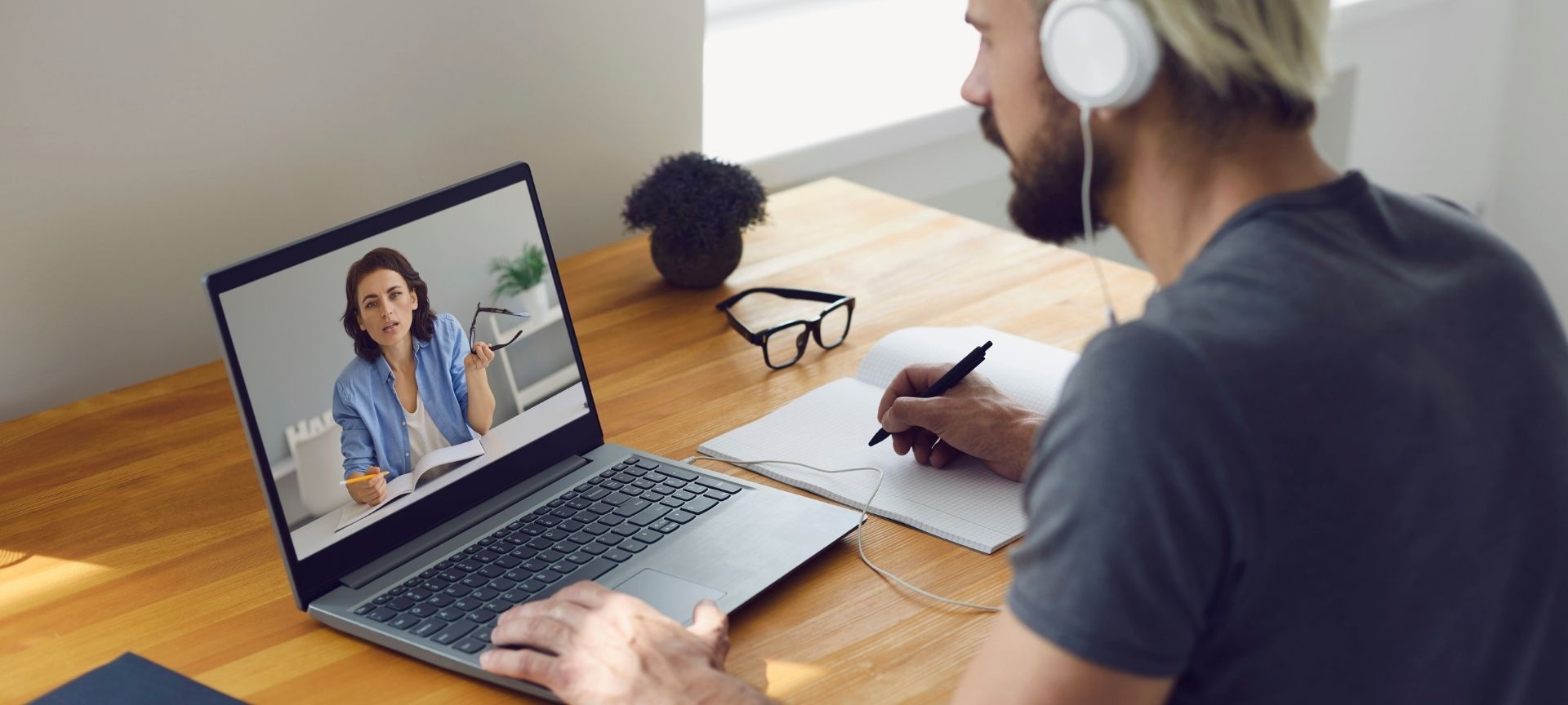 photo of a man having online tutoring lessons or a meeting