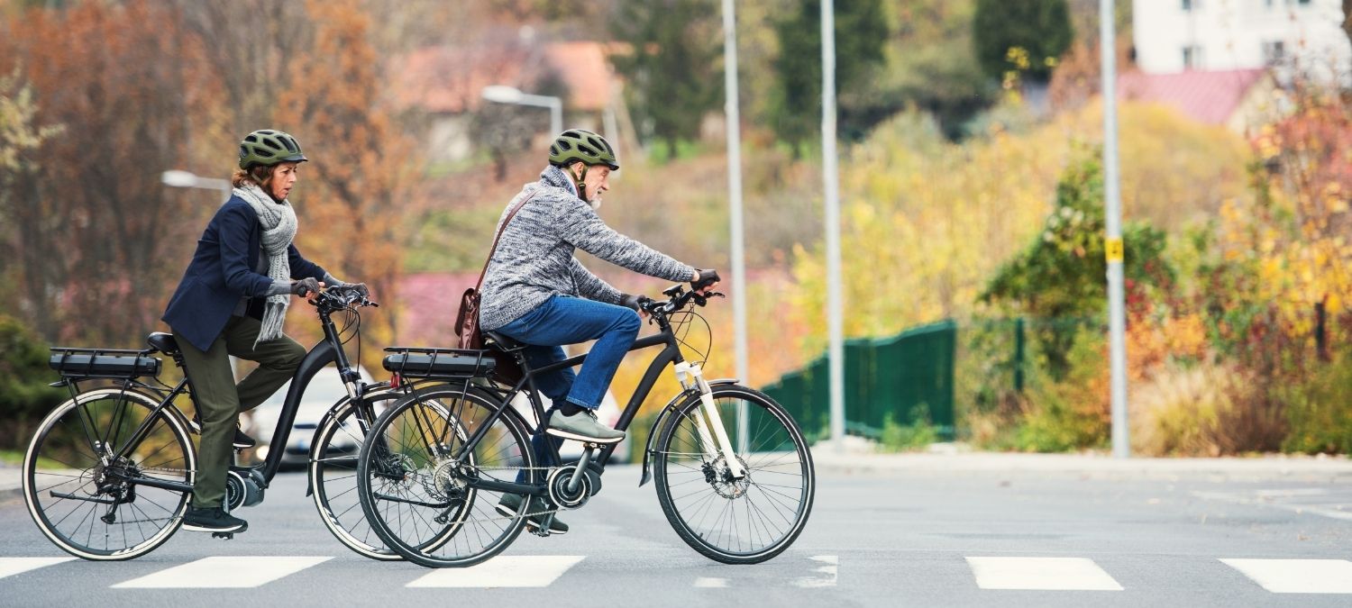 couple cycling on electric bikes