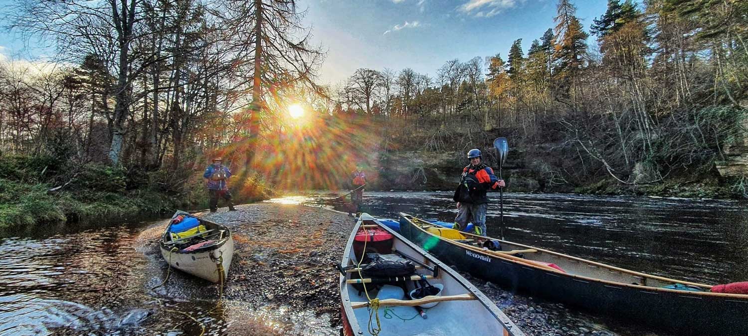 Photo of men in canoes from Liquid Footprints