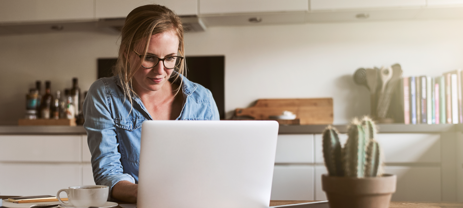 photo of a lady on a computer at home