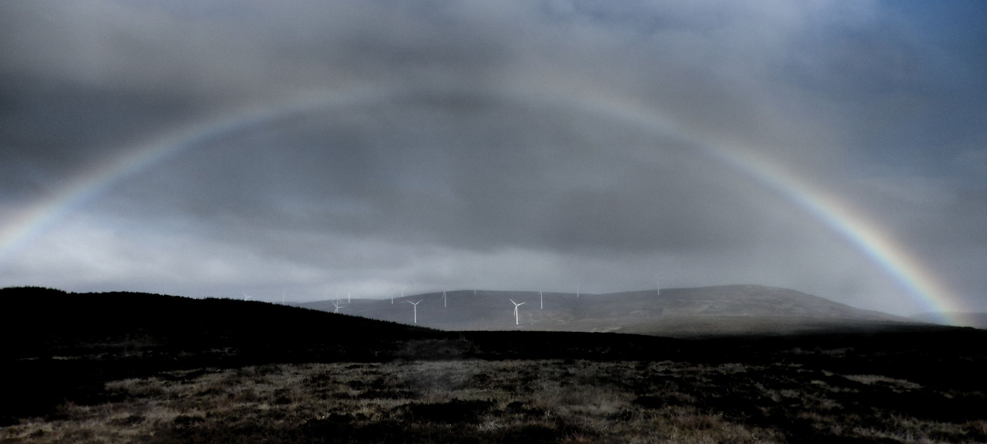 Dorenell wind farm with rainbow above