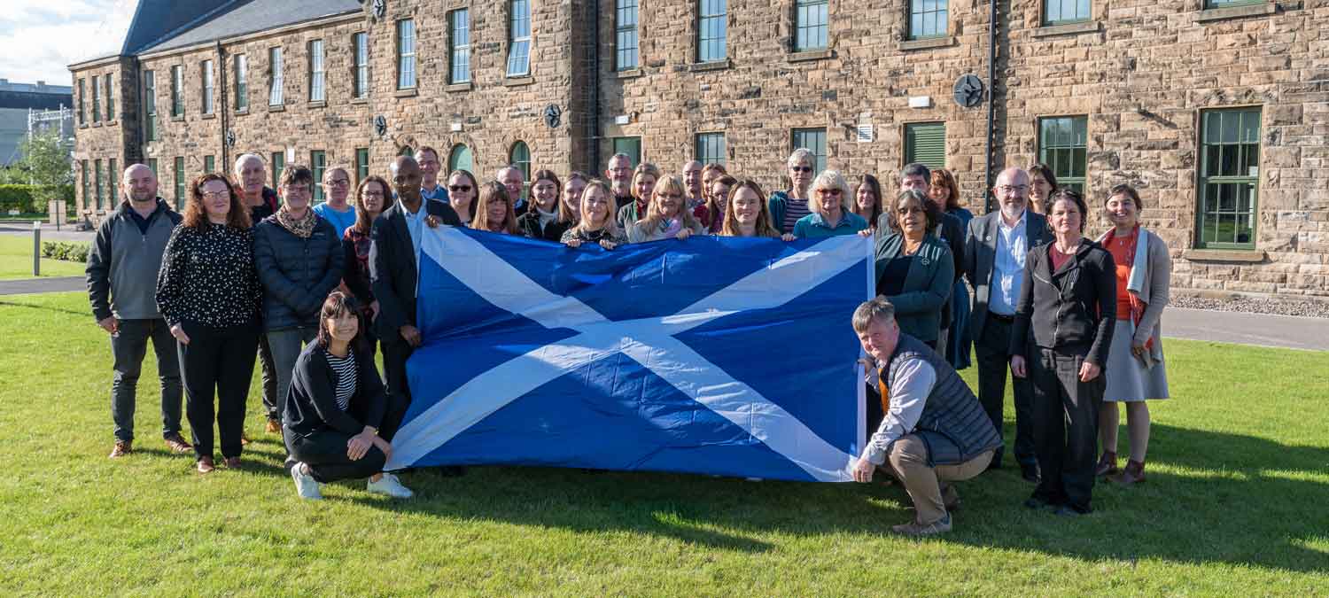 foundation Scotland staff holding a saltire flag