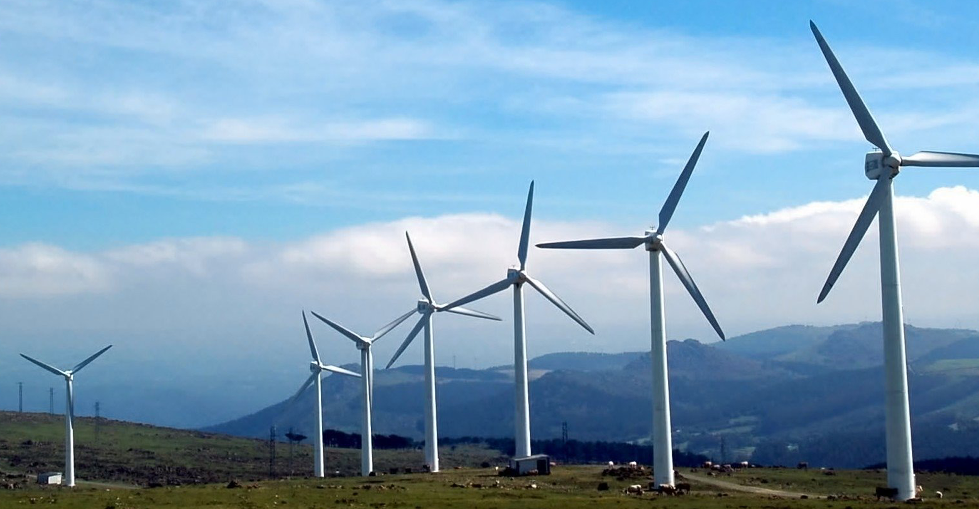 a row of onshore wind turbines