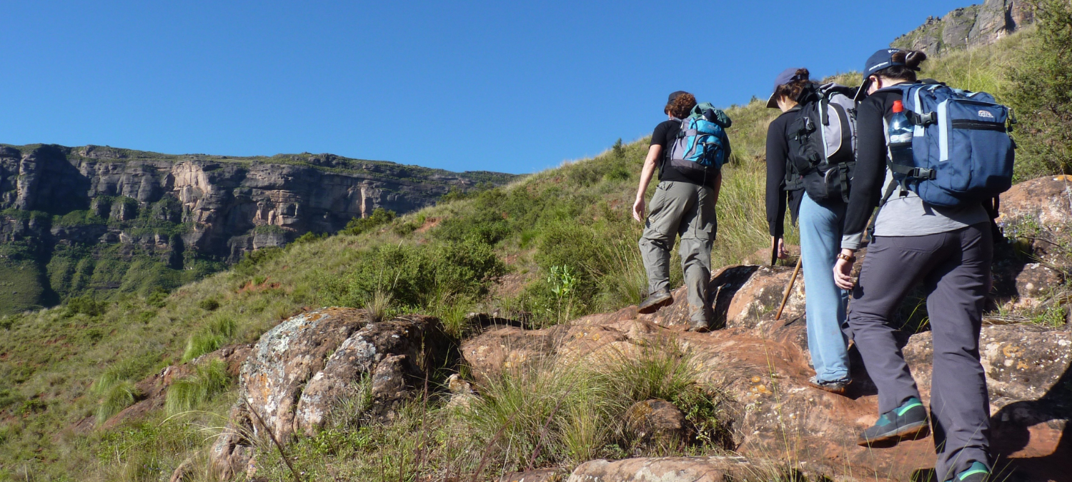 young people on a hill trek