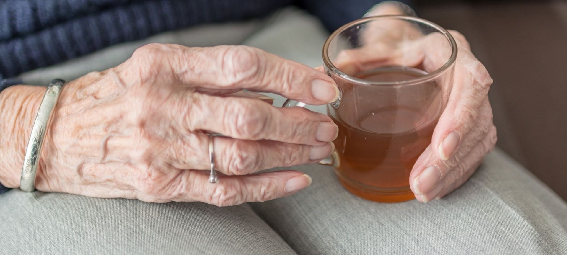 hands holding tea cup