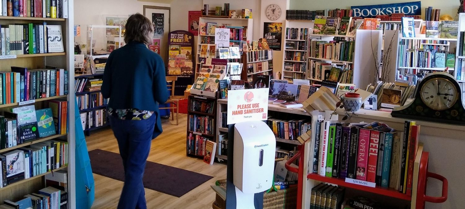 The inside of a bookshop with shelves filled with books 