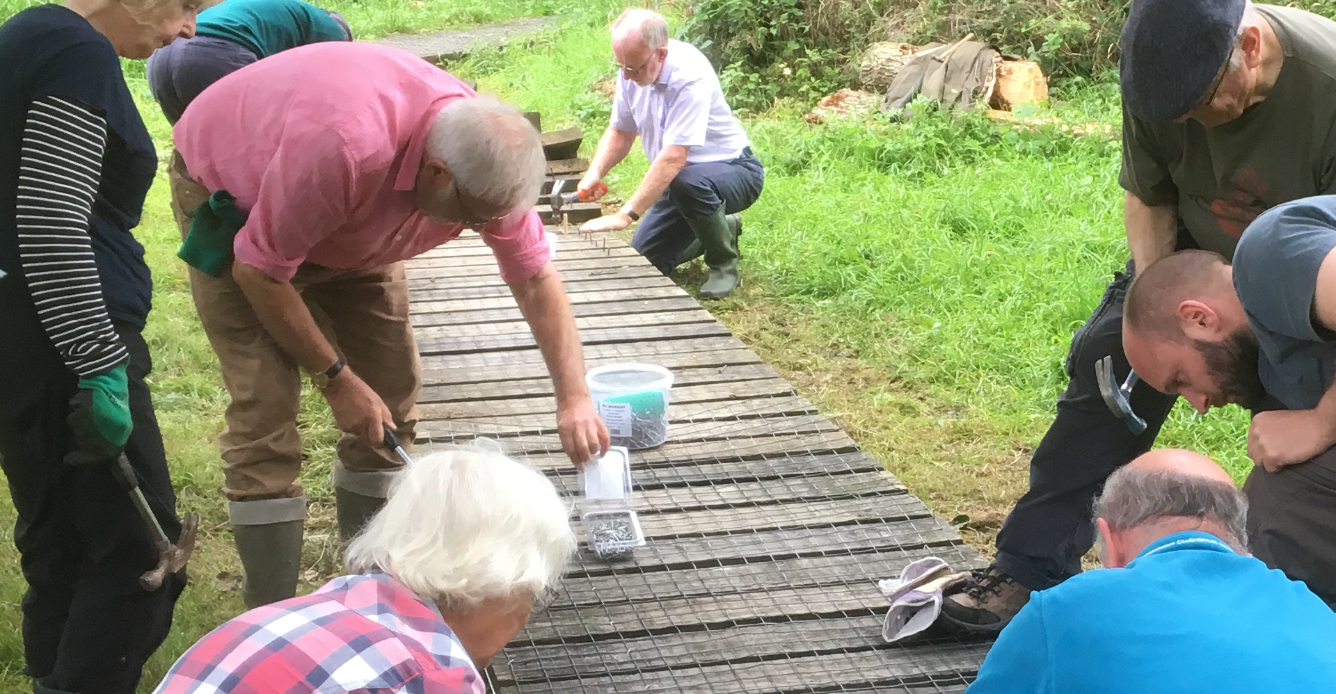 community members helping to build a new boardwalk