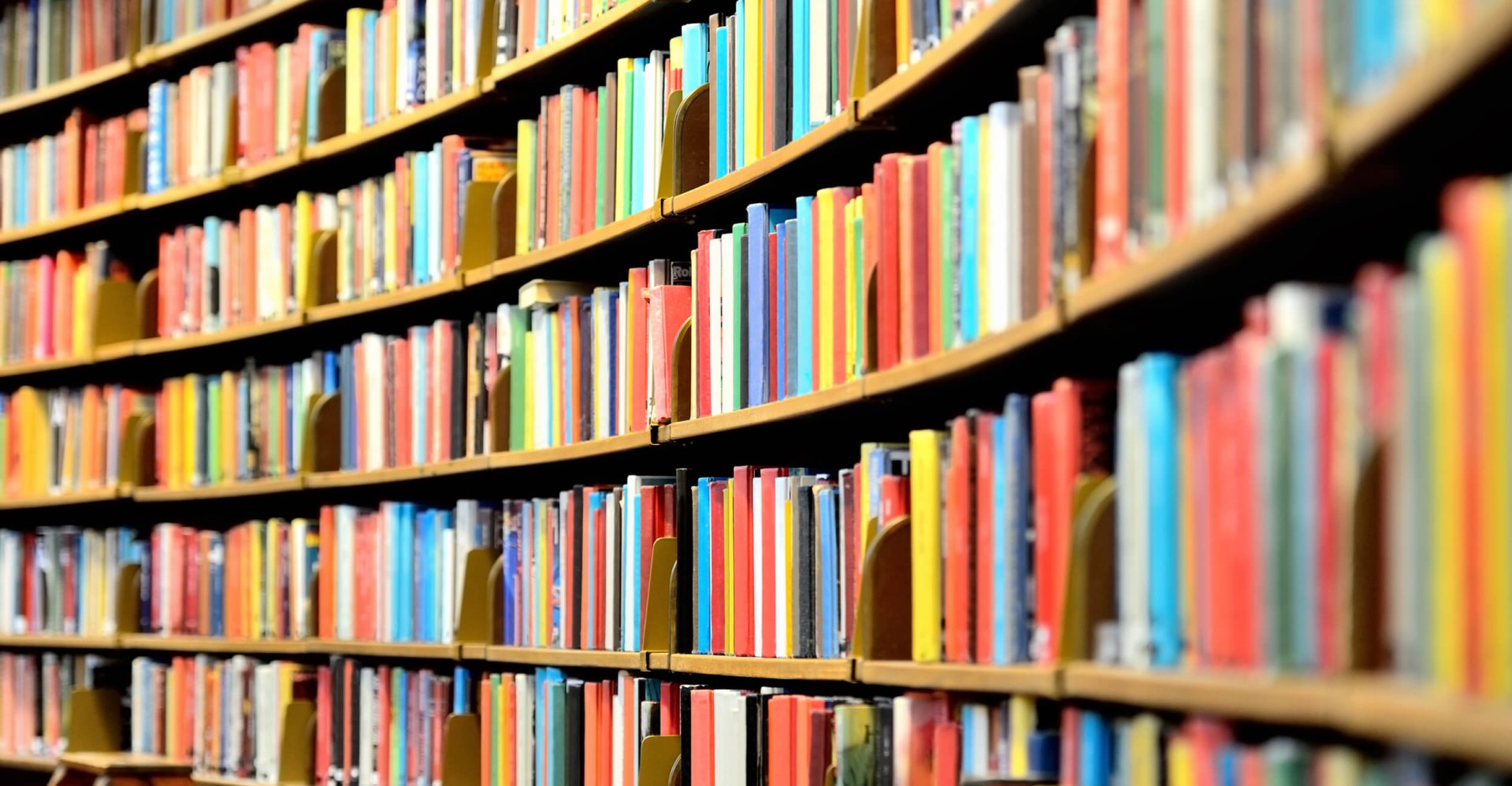 photo of library shelves full of books 