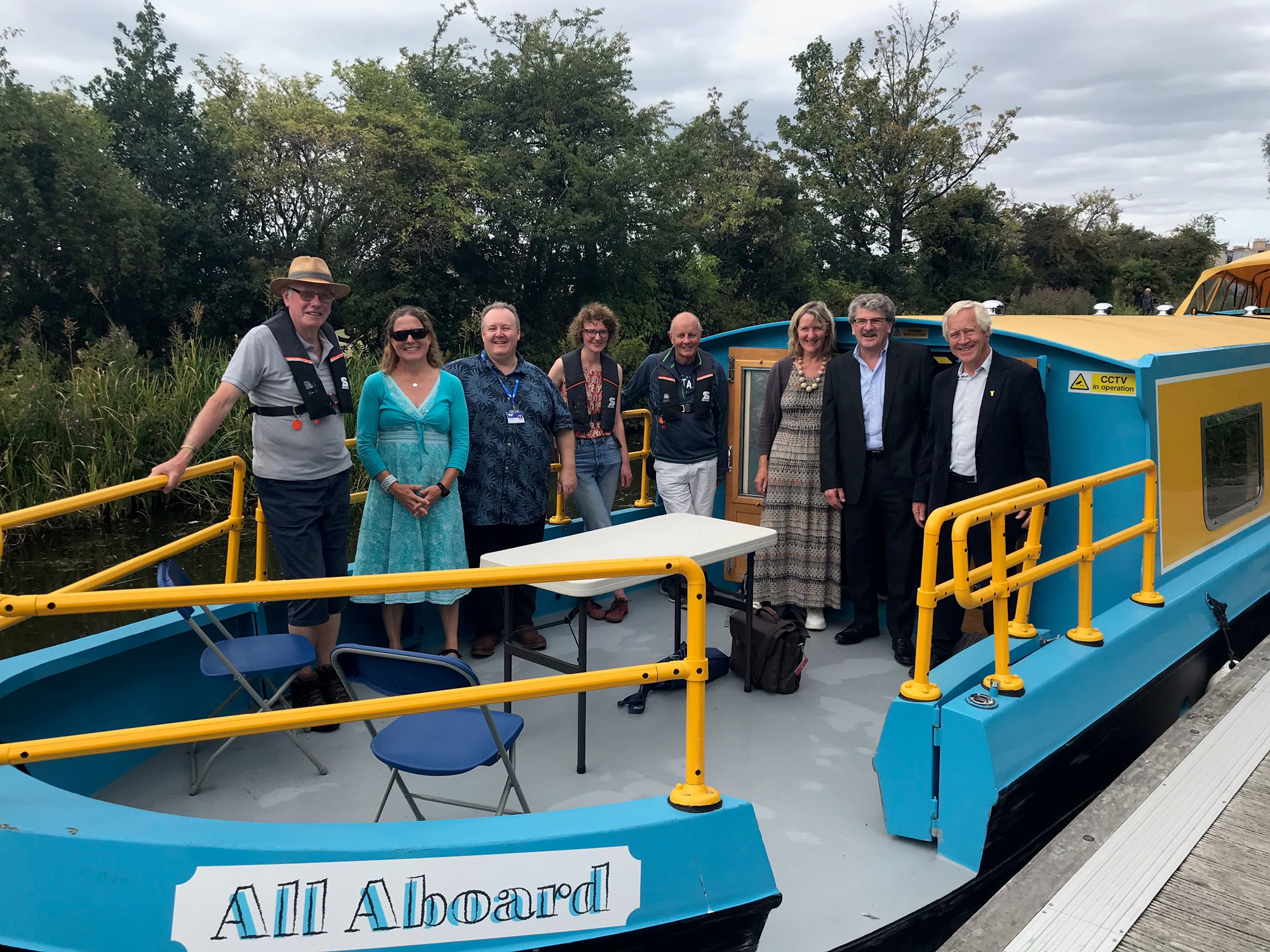 Photo of people standing on a boat