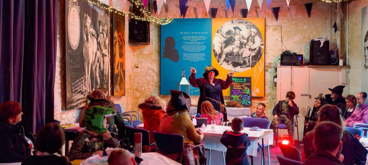 a storytelling session at an event celebrating Robert Burns