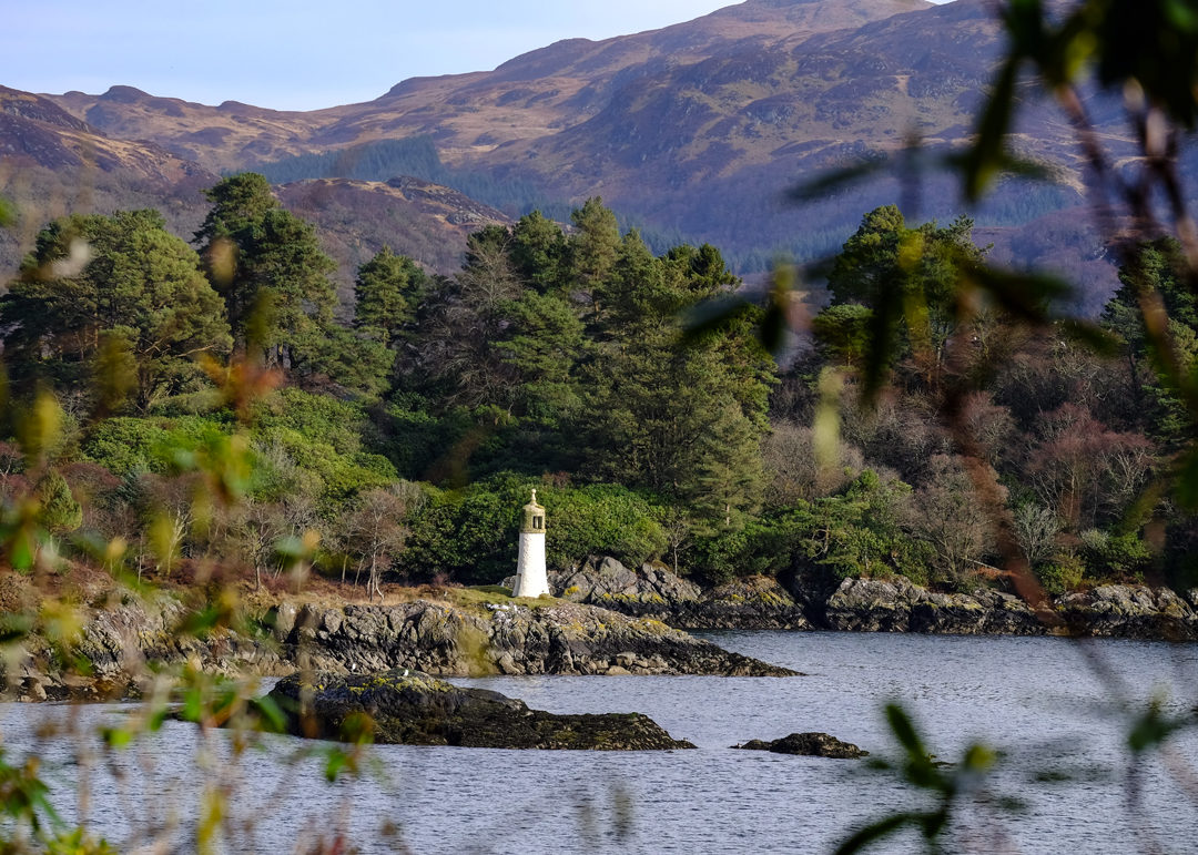 Small lighthouse at the end of a loch